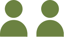 A simple green silhouette icon of two people, shown from the shoulders up. The figures are depicted without facial features or distinct details.