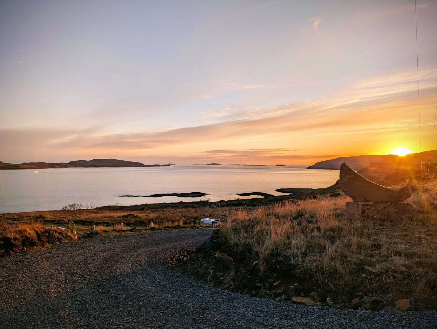 Sunset over a coastal landscape.